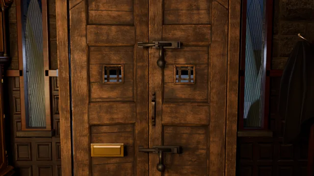 The front door from inside, both iron bolts drawn across
